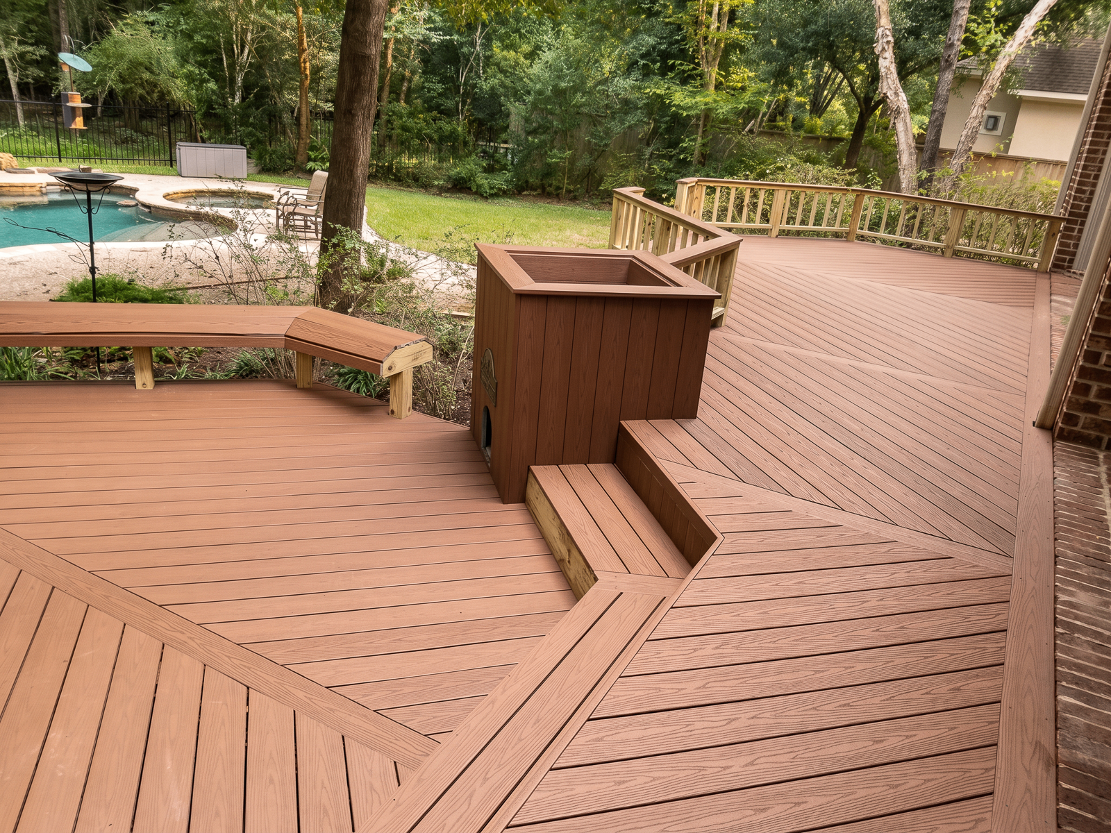 Multi-level composite deck with planter and bench in Montgomery County TX
