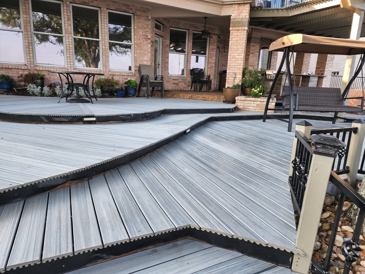 Multi-level composite deck with outdoor kitchen in The Woodlands TX