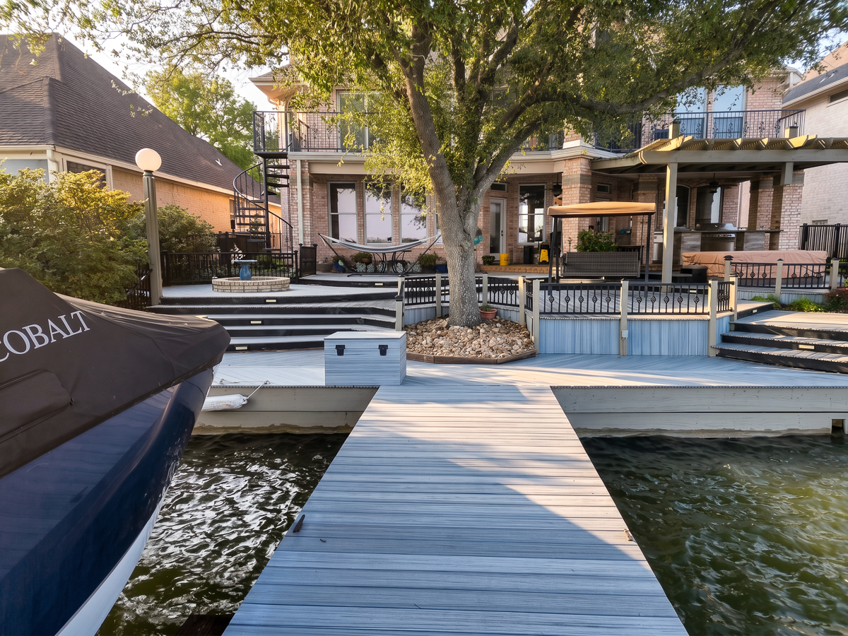 Lakefront composite deck and boat dock in Conroe TX