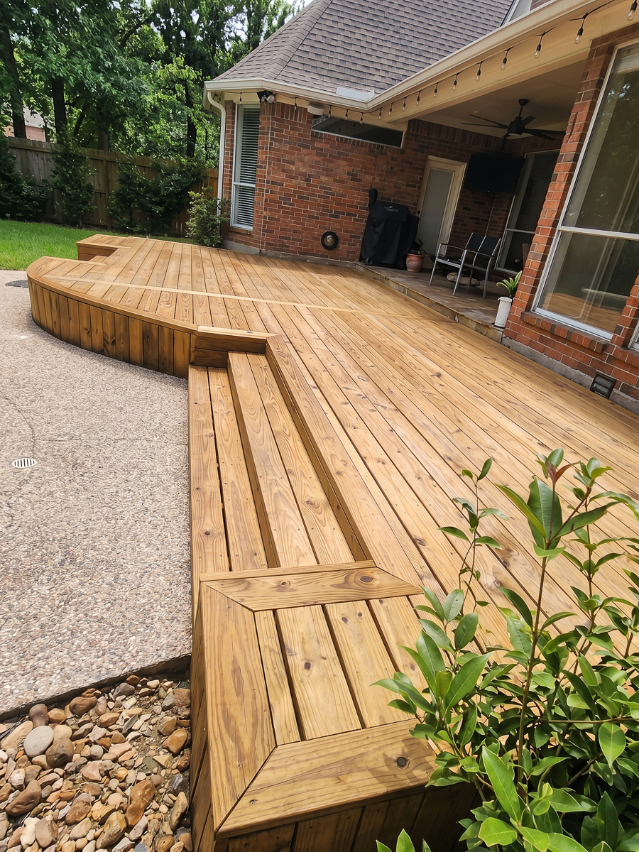 Wrap-around pressure-treated deck with built-in steps in The Woodlands TX